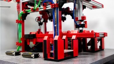 a red and black machine with wires and wires