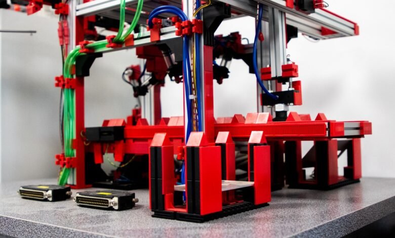 a red and black machine with wires and wires