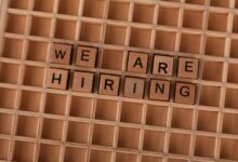 wooden tile letters spelling we are hiring