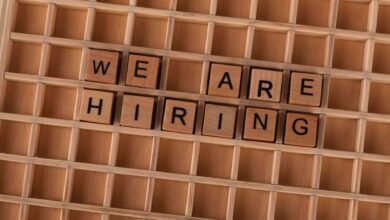 wooden tile letters spelling we are hiring