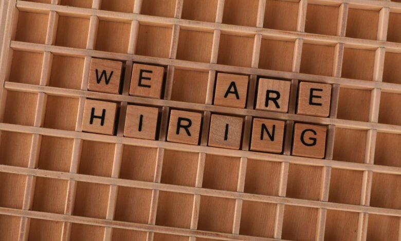 wooden tile letters spelling we are hiring