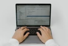 hands on a laptop keyboard