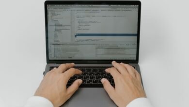 hands on a laptop keyboard