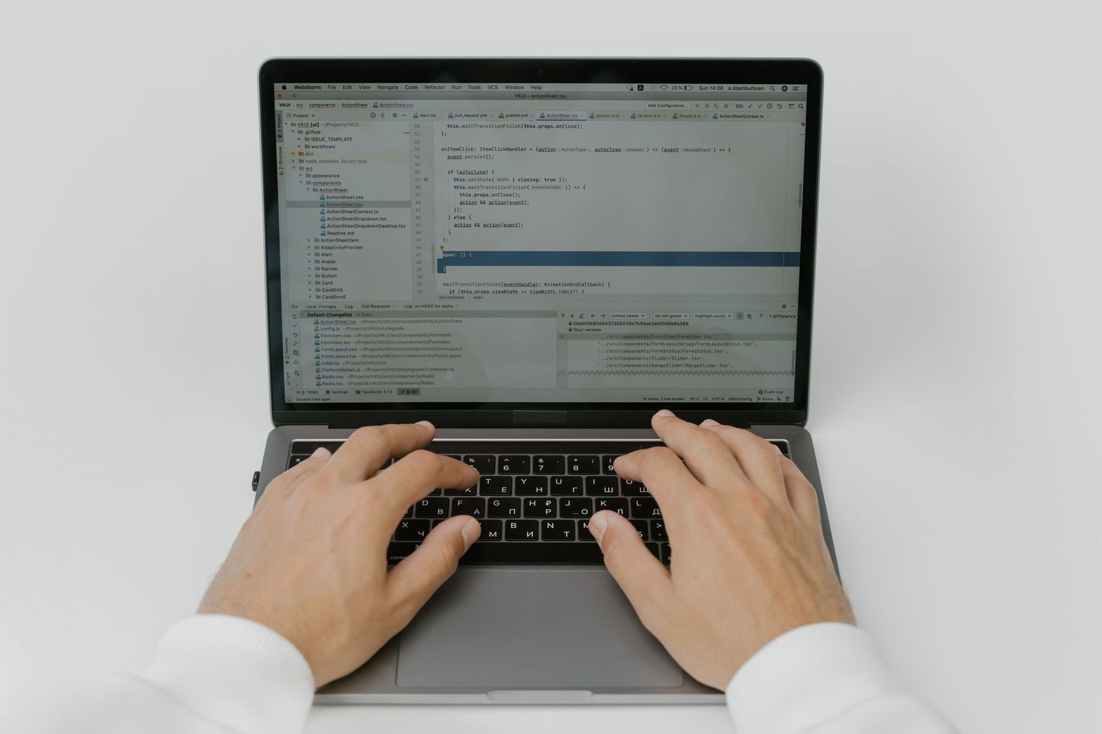 hands on a laptop keyboard