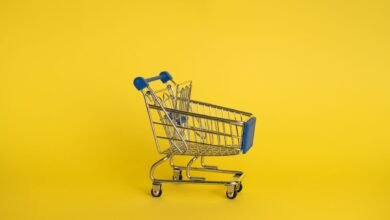 empty shopping cart on yellow background