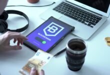 tablet leaning on a laptop