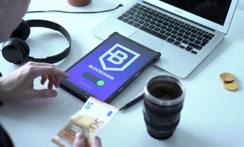 tablet leaning on a laptop